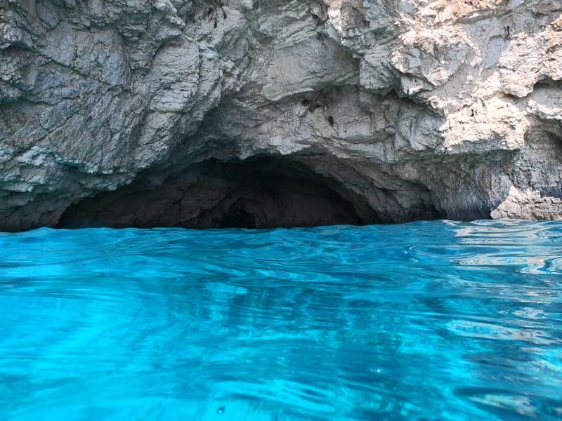 Cave entrance at Santa Marija Bay, Comino, natural light streaming in