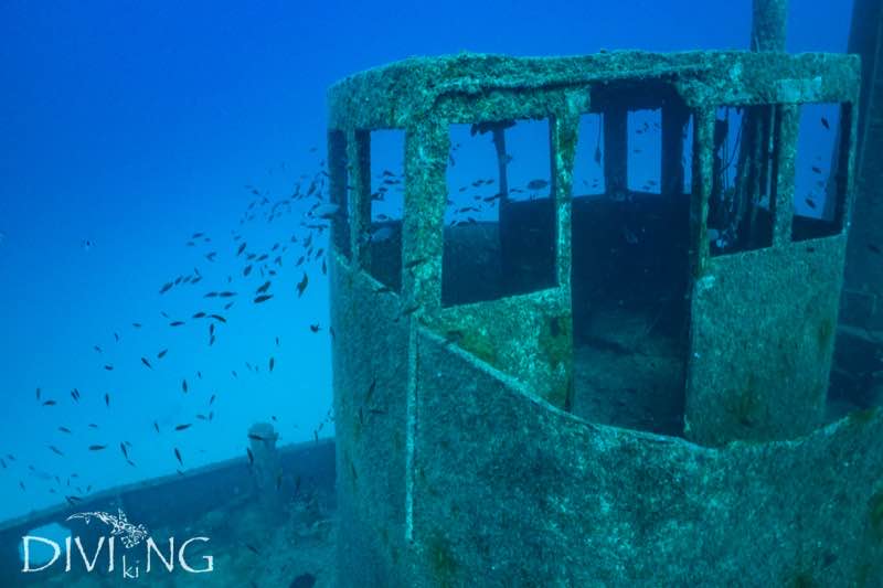 Wheelhouse of the MV Rozi wreck with fish schooling, Cirkewwa