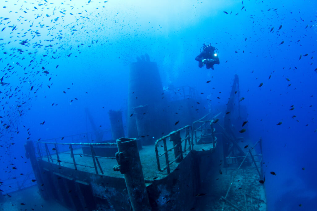 Diver approaching cave entrance, Malta